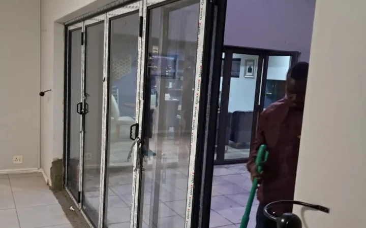 Aluminium stacking doors fitted indoors with protective tape still on