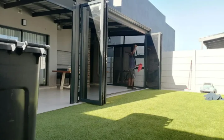Installer testing charcoal aluminium stacking doors